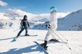 Student and ski teacher on pist Royalty Free Stock Photo
