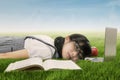 Student sleeping on laptop at grass Royalty Free Stock Photo