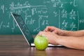 Student solving math's problem on laptop Royalty Free Stock Photo