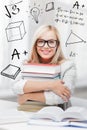 Student with stack of books and doodles