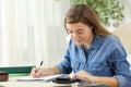 Student studying calculating with a calculator