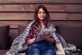 Student studying while sitting on the sofa in a cosy atmosphere Royalty Free Stock Photo