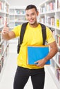 Student success successful thumbs up library learning portrait format smiling people