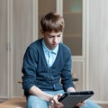 Student and tablet in classroom