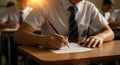 Student taking exam in classroom education and learning concept Royalty Free Stock Photo