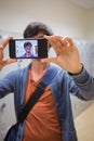 Student taking his selfie on smartphone Royalty Free Stock Photo