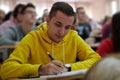 student taking notes while studying in high school Royalty Free Stock Photo