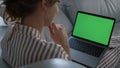 Student talking online chroma key laptop with family closeup. Girl rest on sofa