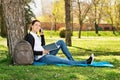 Student talking on the phone in a park Royalty Free Stock Photo