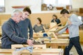 student and teacher in carpentry class Royalty Free Stock Photo