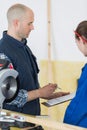 Student and teacher in carpentry class using circular saw Royalty Free Stock Photo