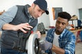 student and teacher in carpentry class using circular saw Royalty Free Stock Photo