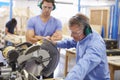 Student And Teacher In Carpentry Class Using Circular Saw Royalty Free Stock Photo