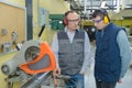 Student and teacher in carpentry class using circular saw Royalty Free Stock Photo