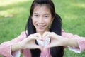 Student teen beautiful girl Dress Pink smile give heart Royalty Free Stock Photo