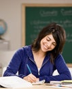 Student with text books doing homework Royalty Free Stock Photo