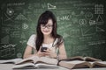 Student texting in the class Royalty Free Stock Photo