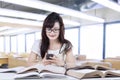 Student texting while studying Royalty Free Stock Photo