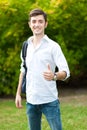 Student thumbs up at the park Royalty Free Stock Photo