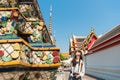 Student traveler touching famous buddhist building