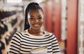 Student, university and portrait of black woman in library for learning, education and reading books. Academy, college Royalty Free Stock Photo