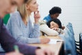 Student, university and sleeping on desk in classroom for boring lecture or burnout, fatigue or scholarship. People Royalty Free Stock Photo