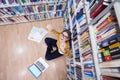 the student uses a notebook and a school library Royalty Free Stock Photo