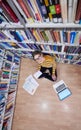 the student uses a notebook and a school library Royalty Free Stock Photo