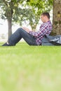 Student using his laptop to study outside Royalty Free Stock Photo