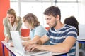 Student using laptop in classroom Royalty Free Stock Photo