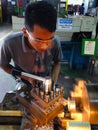 Student using lathe machine