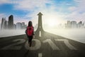 Student walking on street with arrow and 2017 Royalty Free Stock Photo