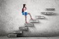 Student walks on stairs with strategy plan Royalty Free Stock Photo