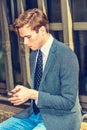 Young Man Texting anywhere. Royalty Free Stock Photo