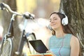 Student wearing headphones listening to music on line