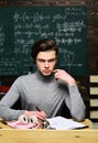 Student will have to be dedicated and self-disciplined to reach his goals. Confident student studying for exam at desk Royalty Free Stock Photo