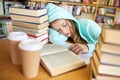 Student or woman with books sleeping in library Royalty Free Stock Photo
