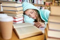 Student or woman with books sleeping in library Royalty Free Stock Photo