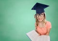 Student woman in mortarboard with encyclopedia Royalty Free Stock Photo