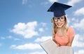 Student woman in mortarboard with encyclopedia Royalty Free Stock Photo