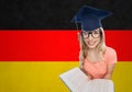 Student woman in mortarboard with encyclopedia Royalty Free Stock Photo