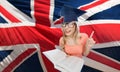 Student woman in mortarboard over english flag Royalty Free Stock Photo