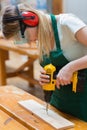 Student in a woodwork class using a drill Royalty Free Stock Photo