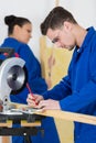 Student woodworking class learning to drill with nails Royalty Free Stock Photo