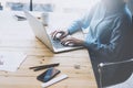 Student work process concept. Young girl working university project with generic design laptop. Smartphone wooden table Royalty Free Stock Photo