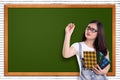 Student writing on empty chalkboard Royalty Free Stock Photo