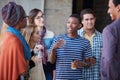 The student years are some of your best years. a group of university students socialising on campus.