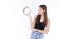 Student young girl holding small global while standing over isolated white background. Happiness woman looking at earth in own Royalty Free Stock Photo