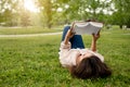Student Young Lady Reading Book Lying On Green Grass Outdoor Royalty Free Stock Photo