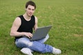 Student young man laptop computer on meadow Royalty Free Stock Photo